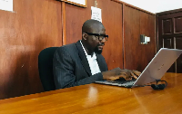 Magistrate Muhammed Krubally follows proceedings on his computer in the courtroom
