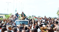 Tanzania opposition leader Tundu Lissu campaigning on top of a vehicle in Dar es Salaam, Tanzania