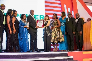Samuel Kofi Dzamesi (middle) receiving the award