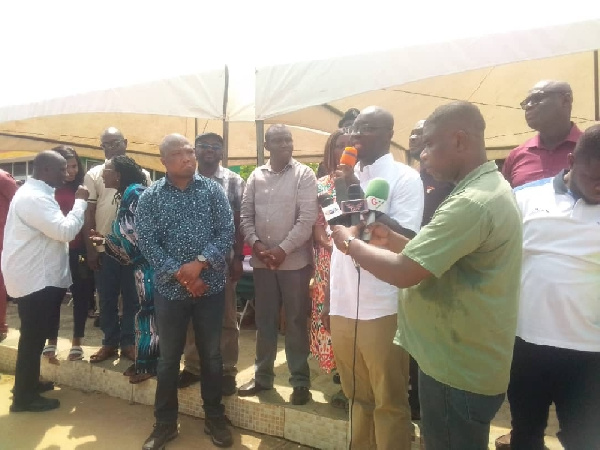 Dr Cassiel Ato Forson addressing the gantering affected by the dam spillage in the Volta Region