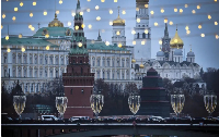 The Kremlin is seen through Christmas decorations on the bank of the Moskva river in downtown Moscow