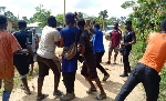 A file photo of a mob assaulting someone