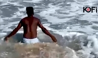 Comedian Funny Face seen bathing in the sea