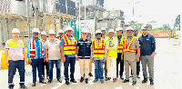 Staff pose for group photo during AKSA plant inspection