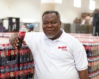 Dr. Kwaku Oteng shows off  the company's new product, Angel Cola