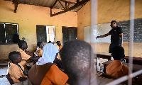 A file photo of a teacher and students