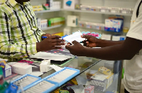 A man shops at a pharmacy in Zambia