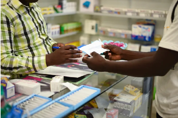 A man shops at a pharmacy in Zambia