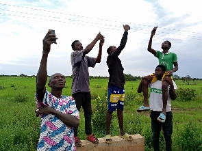 Residents of Fio, Sakori, and Fungu going through the hassle of reaching a network connection