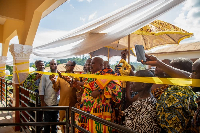 Chief of Sefwi Paboase, Nana Frimpong Manso Ababio II cutting the ribbon