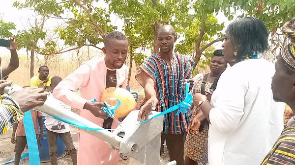 The Assemblyman together with the prophetess standing beside the newly acquired borehole