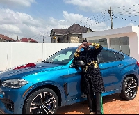 Medikal poses with his car gift