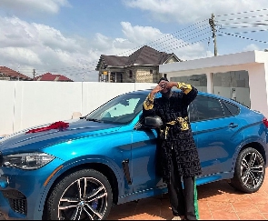 Medikal poses with his car gift