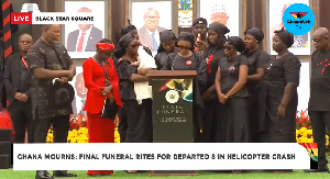 Ursula Wematu Asaghedewe (surrounded by family) reading her tribute at the state funeral