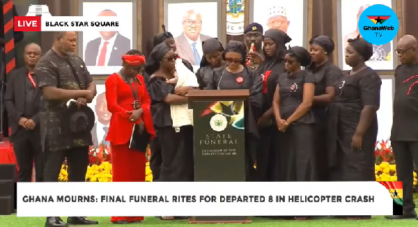 Ursula Wematu Asaghedewe (surrounded by family) reading her tribute at the state funeral