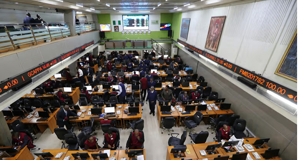 Employees work at computer terminals on the trading floor at the Nigerian Stock Exchange (NSE)