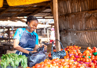 A woman shopping at a local market, South Africa