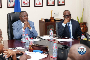 Chief Justice Baffoe-Bonnie listening to how Kwame AI works