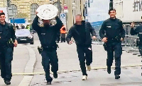 The four policemen who carried  the trophy