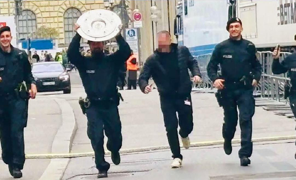 The four policemen who carried the trophy