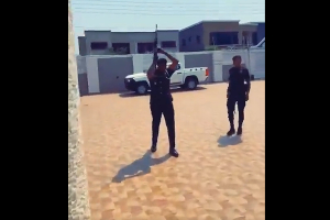 A snippet from the video showing a police security detail firing the gunshots into the air