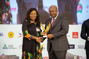 Ing. Patricia Obo-Nai receiving the award from President, H.E John Dramani Mahama