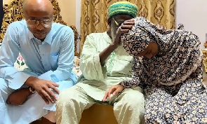 Andre Ayew and his daughter during the visit with National Chief Imam