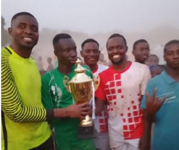 The winners with their trophy