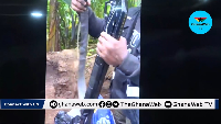 Officer displays firearm after removing layers of packaging