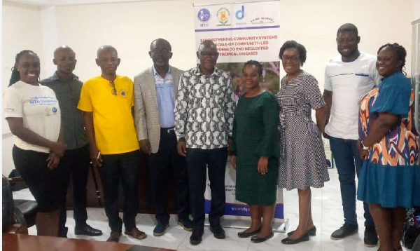 Participants of a bi-annual project update and dialogue meeting pose for a photo