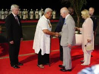 Britain's King Charles III (C) shake hands with the delegates for a family photo