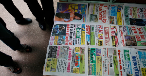 Ivorians read newspaper headlines as the country waits for election results, Abidjan, Nov 30 Ivorians read newspaper headlines as the country waits for election results, Abidjan, Nov 30