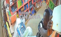 A screengrab showing the moment the suspect climbed up to remove the router