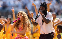 A picture of Nigerian artiste Burna Boy and Shakira performing at the World Cup finals