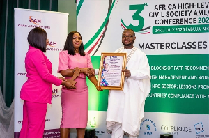 Jennifer Y. Annor-Tettey receiving the honour on behalf of President John Mahama