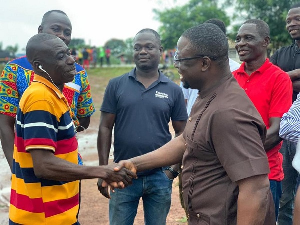 Fred Kyei Asamoah, right interacting with constituents
