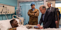 The injured soldier with the Secretary-General of the UN, António Guterres, by his side