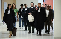 French lawyer Matthieu Chirez arrives for the trial of 14 alleged smugglers in Paris