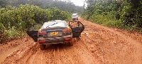 Taxi stuck in a muddy road