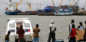 People gather around a speedboat of a type believed to be used by drug traffickers People gather around a speedboat of a type believed to be used by drug traffickers