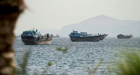 The Strait of Hormuz remains blocked as attacks continue despite ceasefire negotiations