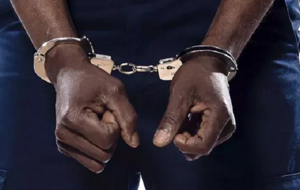 File photo of a handcuffed man