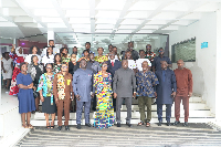The minister among other stakeholders in a photograph