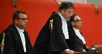 The verdict was read out in a Genoa court by Judge Paolo Lepri (C)
