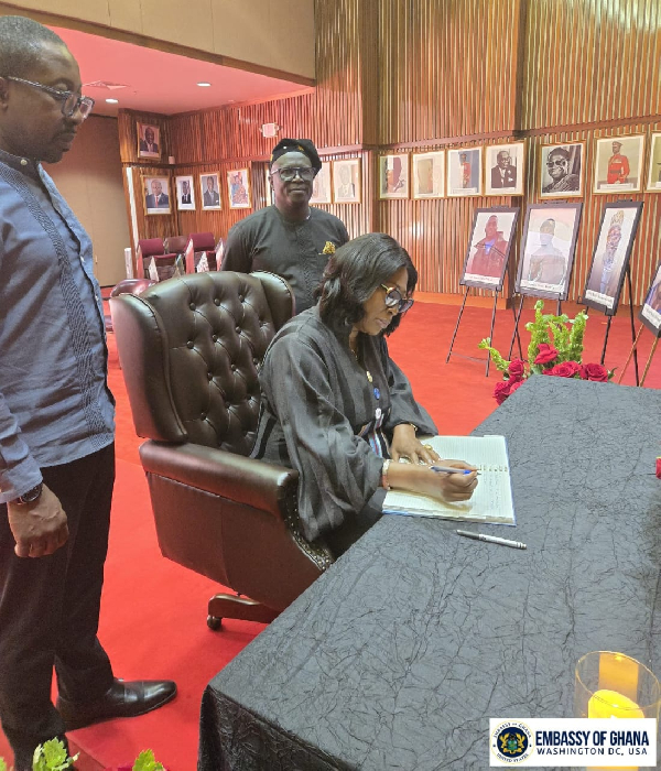 Acting Head of Mission, Jane Gasu Aheto signing the book of condolence