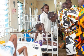 The Wenchimanhene interacting with a child-patient at the facility