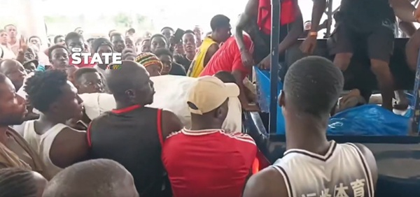 Residents convey one corpse from the mining site