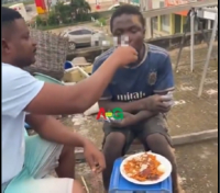 A screenshot from the video capturing the moment the suspected thief was being fed