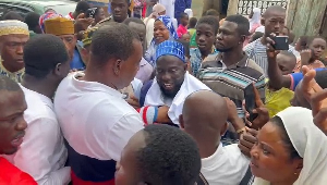 NDC defector being dressed in an NPP T-shirt by Wontumi