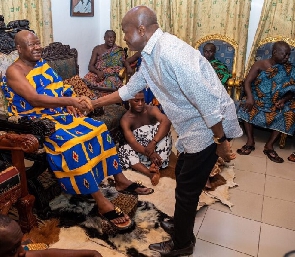 Stephen Ayesu Ntim exchanging pleasantries with a chief